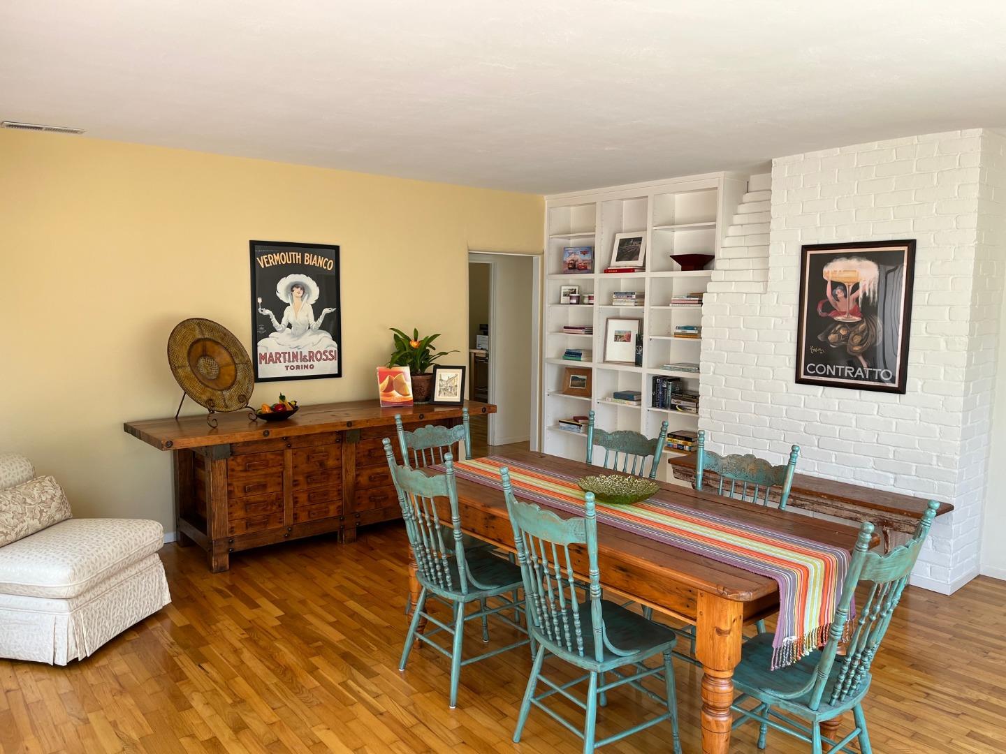 529 Monterey Drive Aptos, CA 95003 - Photo 8 of 32 a dining room with a wooden table and chairs