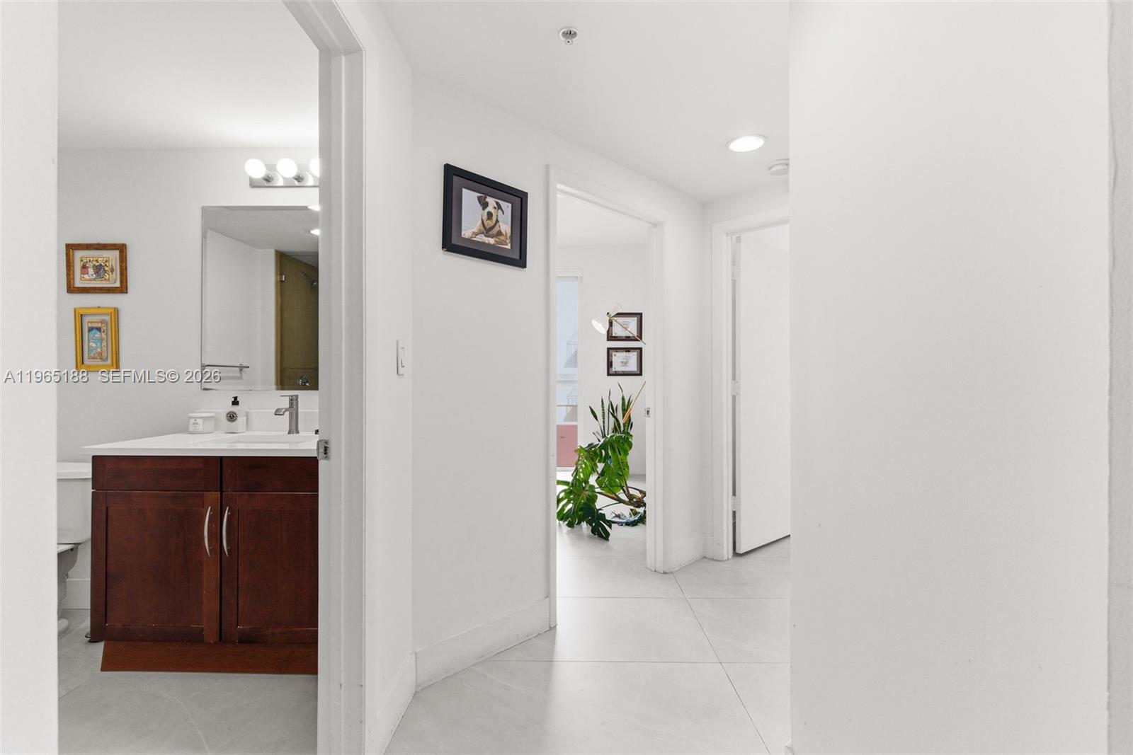7290 Southwest 90th Street, Unit 209 Miami, FL 33156 - Photo 22 of 40 a bathroom with a sink and a mirror