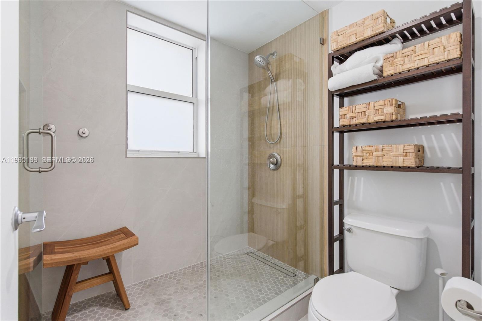 7290 Southwest 90th Street, Unit 209 Miami, FL 33156 - Photo 27 of 40 a bathroom with a toilet and a shower
