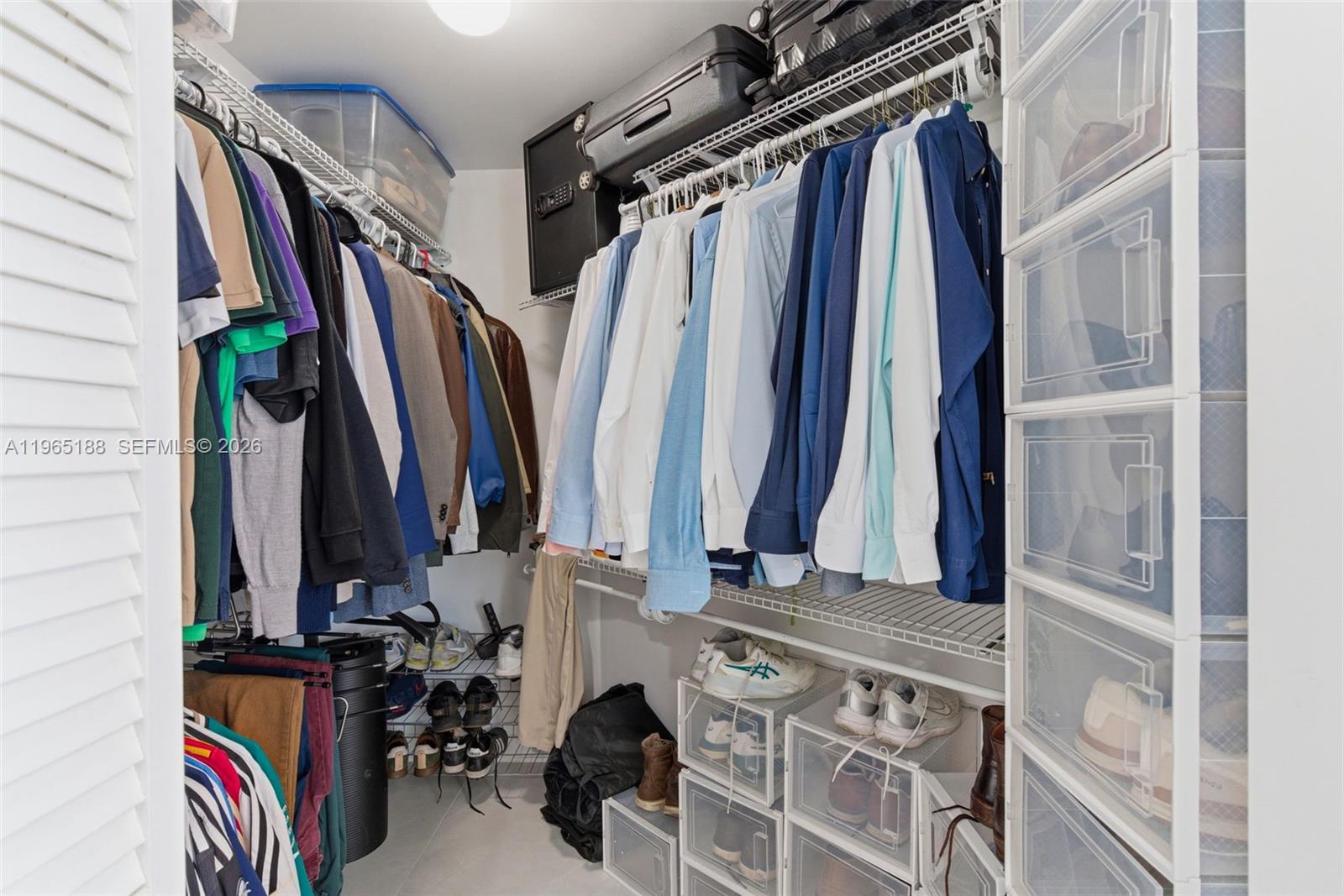 7290 Southwest 90th Street, Unit 209 Miami, FL 33156 - Photo 28 of 40 a view of walk in closet with clothes