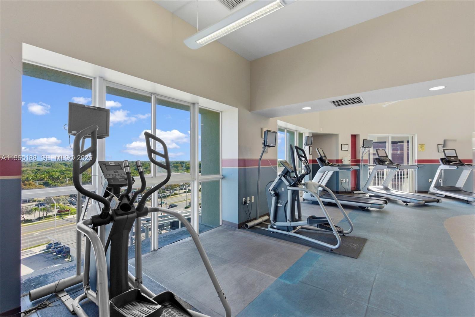 7290 Southwest 90th Street, Unit 209 Miami, FL 33156 - Photo 39 of 40 a view of a room with gym equipment