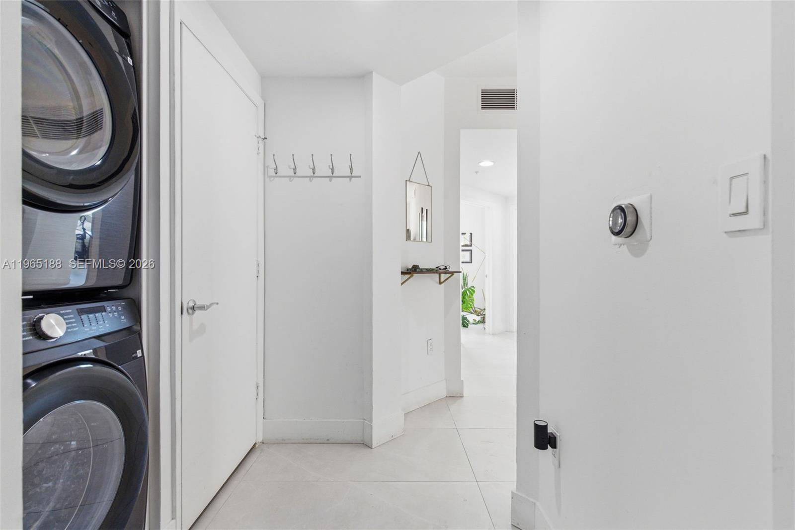 7290 Southwest 90th Street, Unit 209 Miami, FL 33156 - Photo 10 of 40 a bathroom with a sink and a mirror