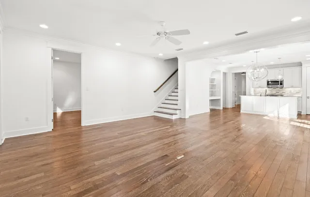 a view of a kitchen with wooden floor and a kitchen