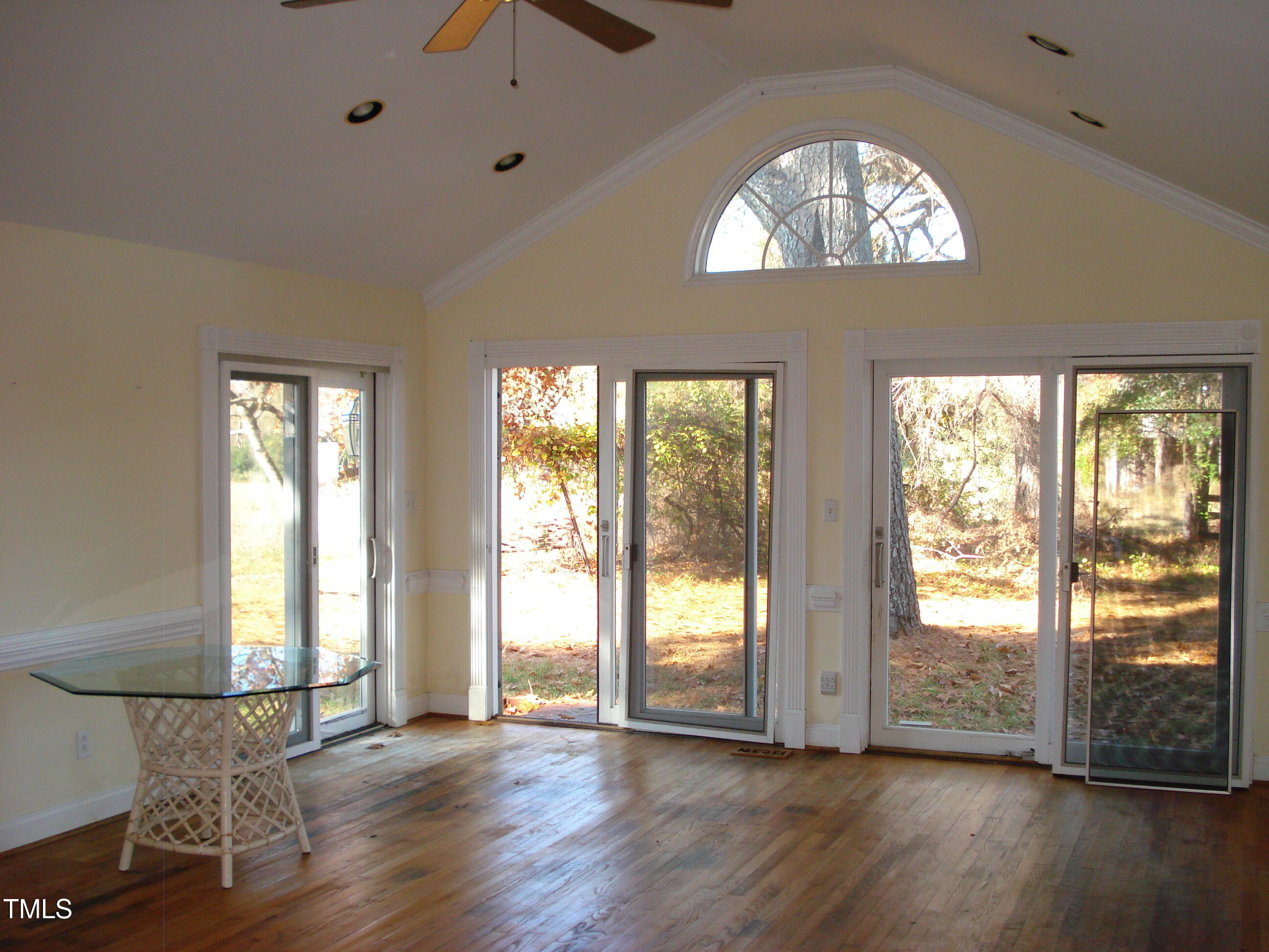 6349 Elevation Road Benson, NC 27504 - Photo 15 of 66 a view of an empty room with wooden floor and a window