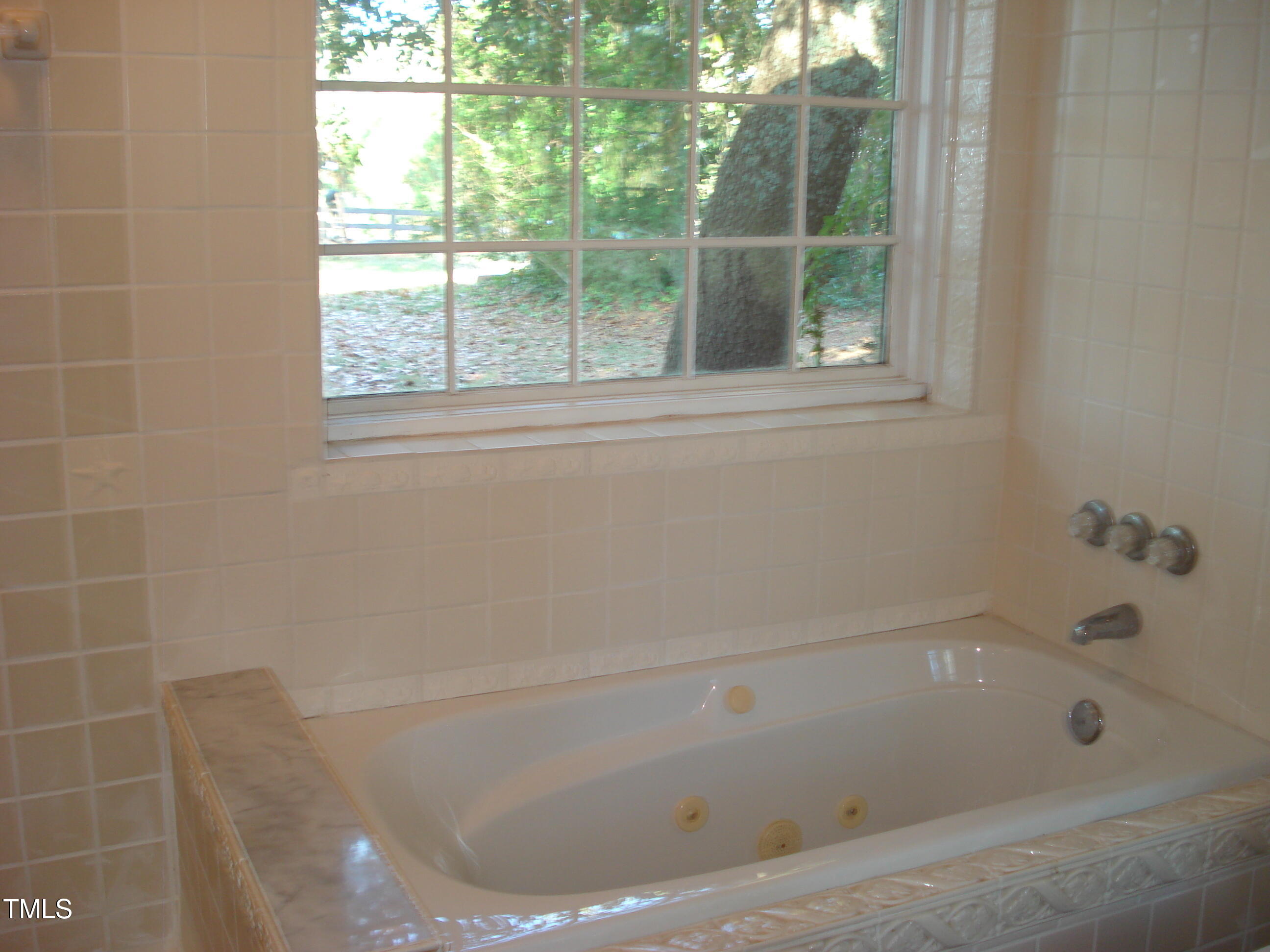 6349 Elevation Road Benson, NC 27504 - Photo 35 of 66 a bathroom with a bathtub