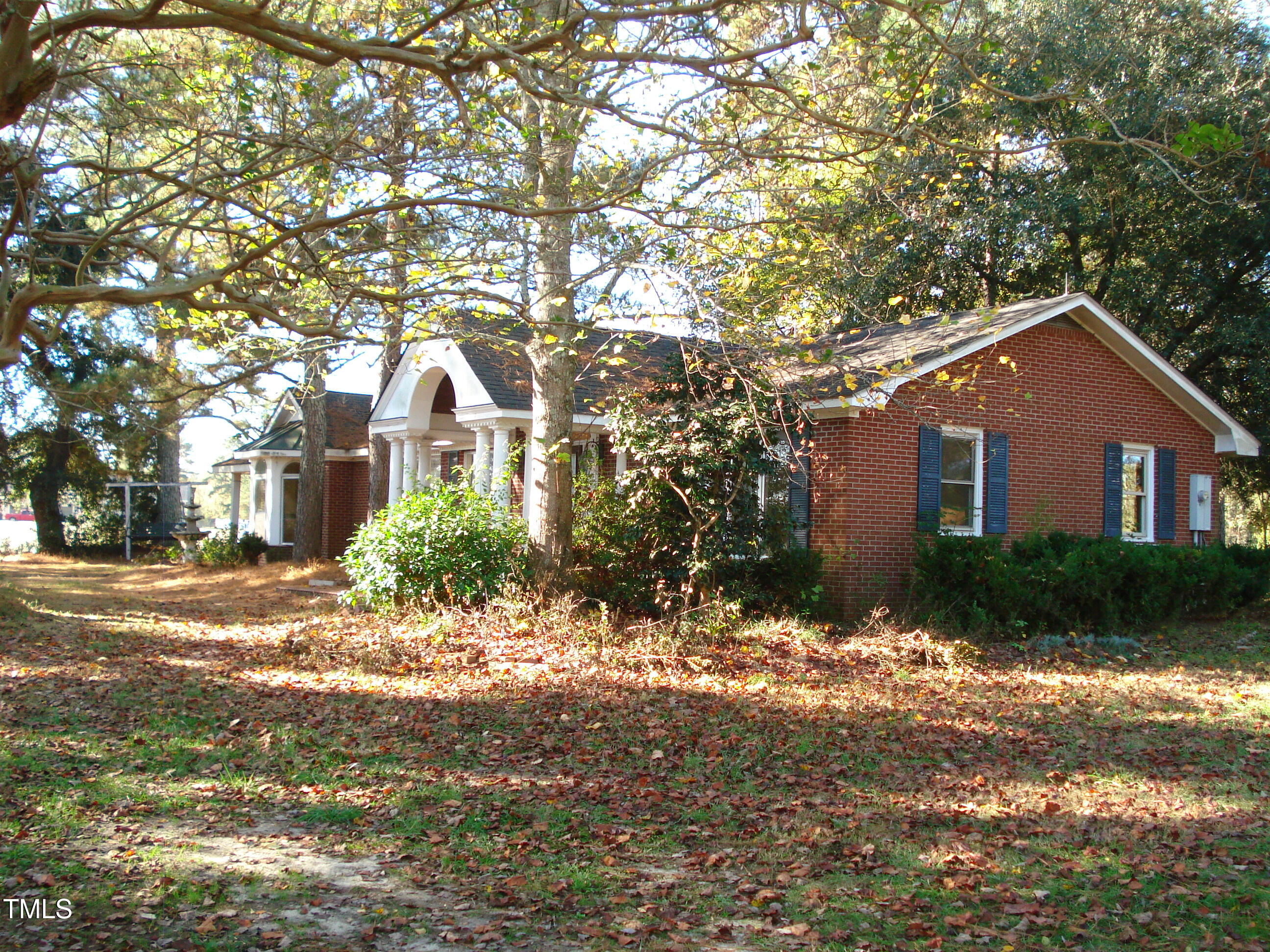 6349 Elevation Road Benson, NC 27504 - Photo 46 of 66 a front view of a house with a yard and garage