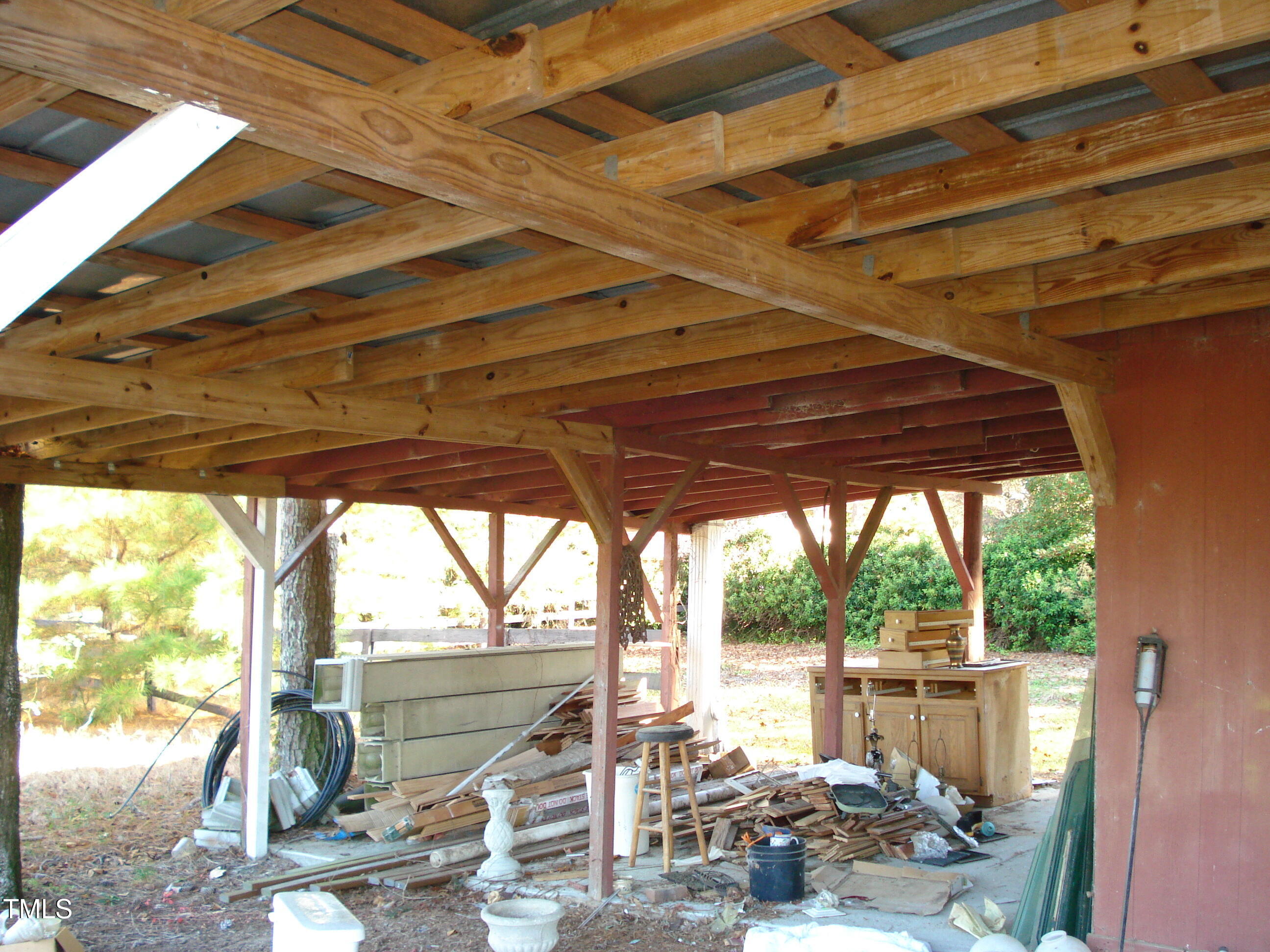 6349 Elevation Road Benson, NC 27504 - Photo 57 of 66 a view of porch with a table and chairs