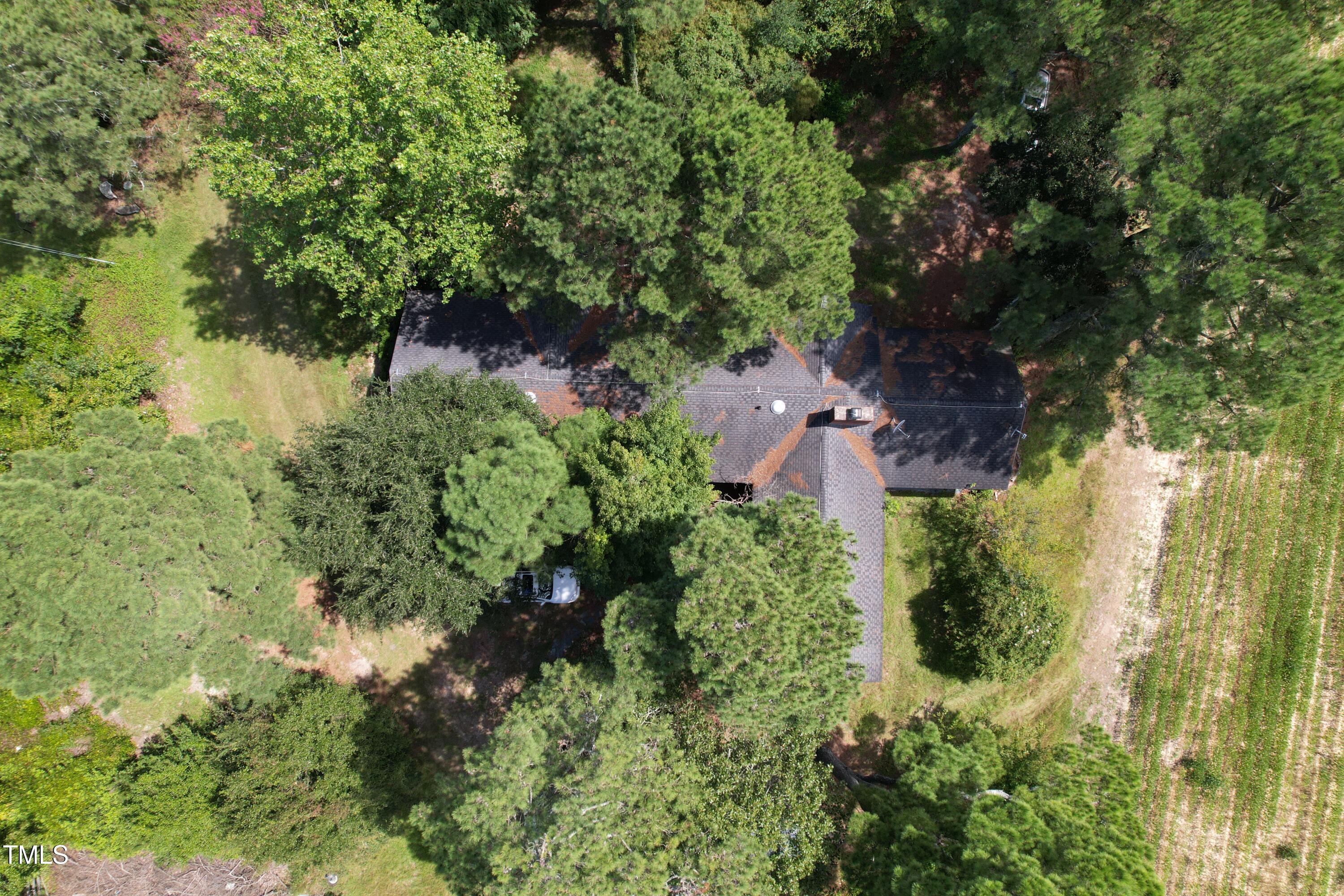 6349 Elevation Road Benson, NC 27504 - Photo 63 of 66 an aerial view of residential house with outdoor space and trees all around