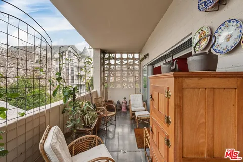 a view of outdoor living space with furniture window and outside view