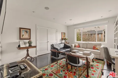 a bathroom with a sink mirror and shower