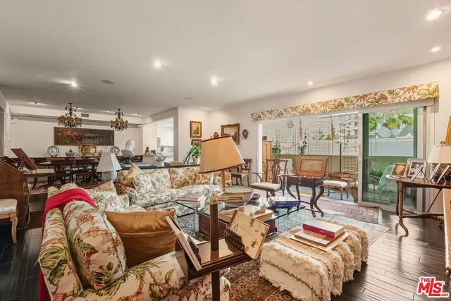 a very nice looking living room with furniture and a large window