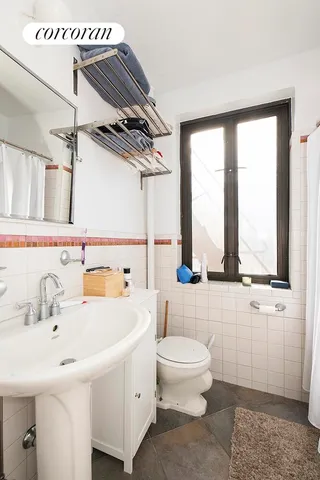 a bathroom with a sink and a large mirror