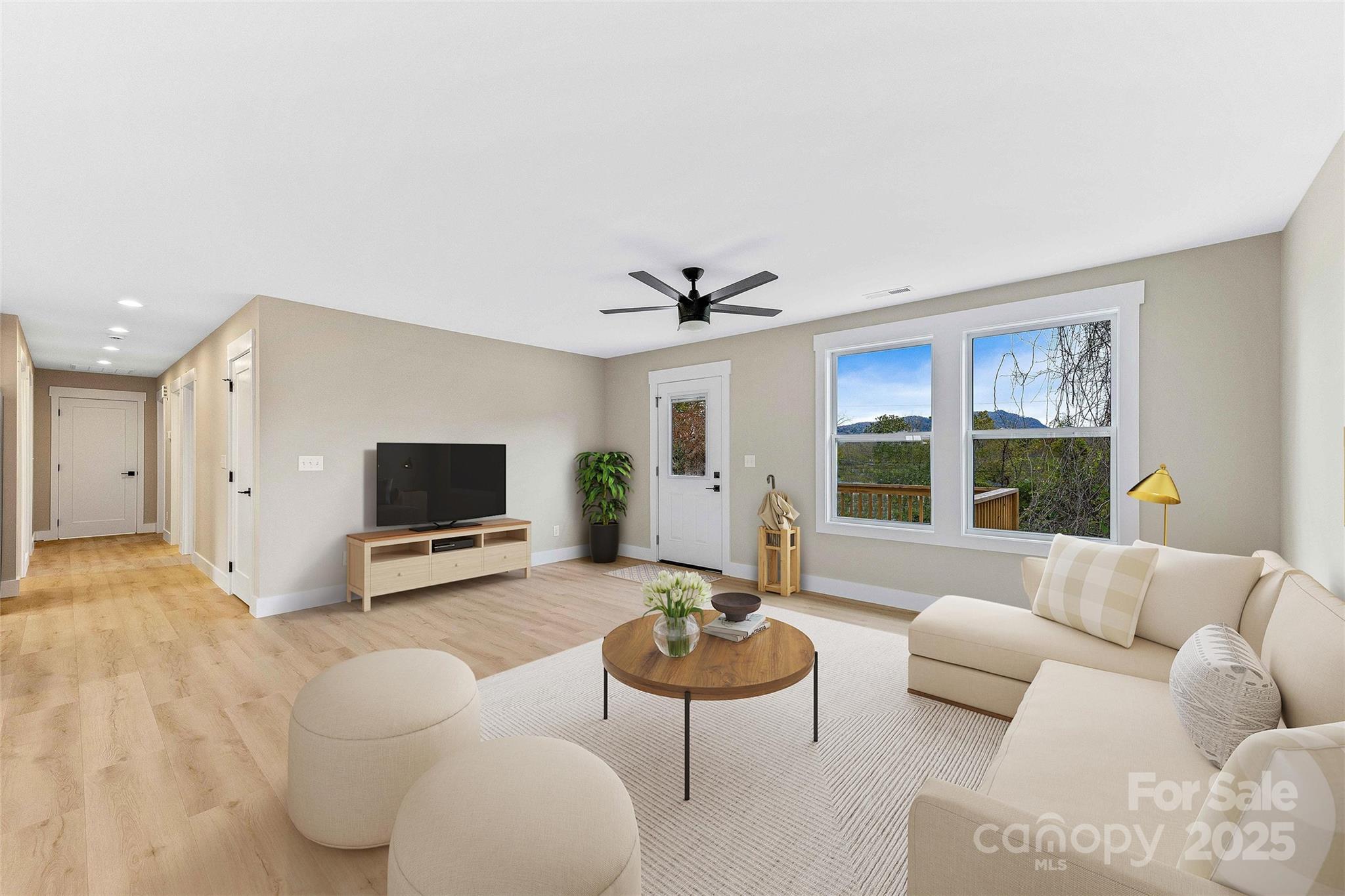 775 Olivette Road Asheville, NC 28804 - Photo 14 of 45 a living room with furniture and a flat screen tv