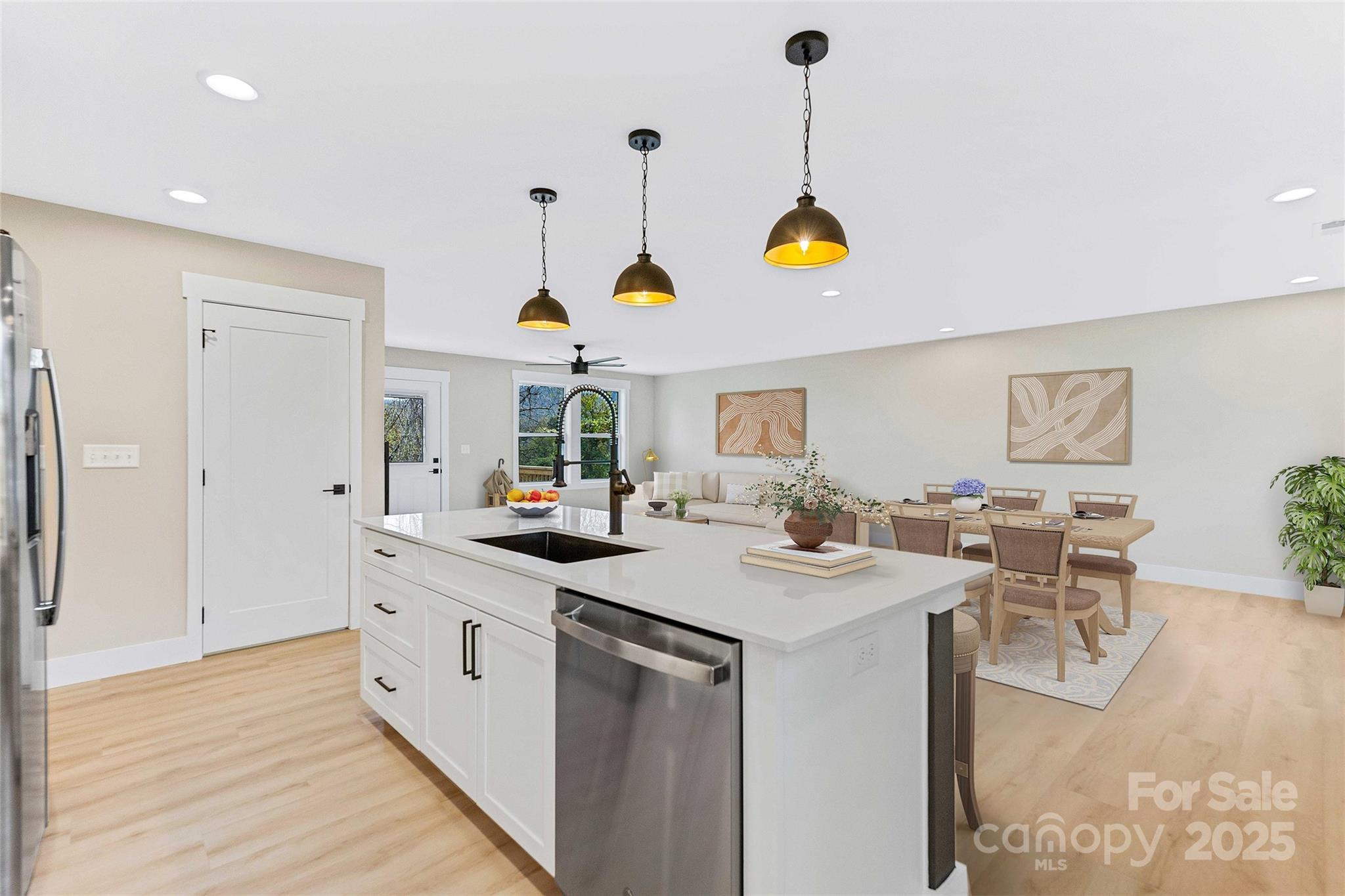 775 Olivette Road Asheville, NC 28804 - Photo 23 of 45 a kitchen with stainless steel appliances granite countertop a sink a stove cabinets counter space and a window