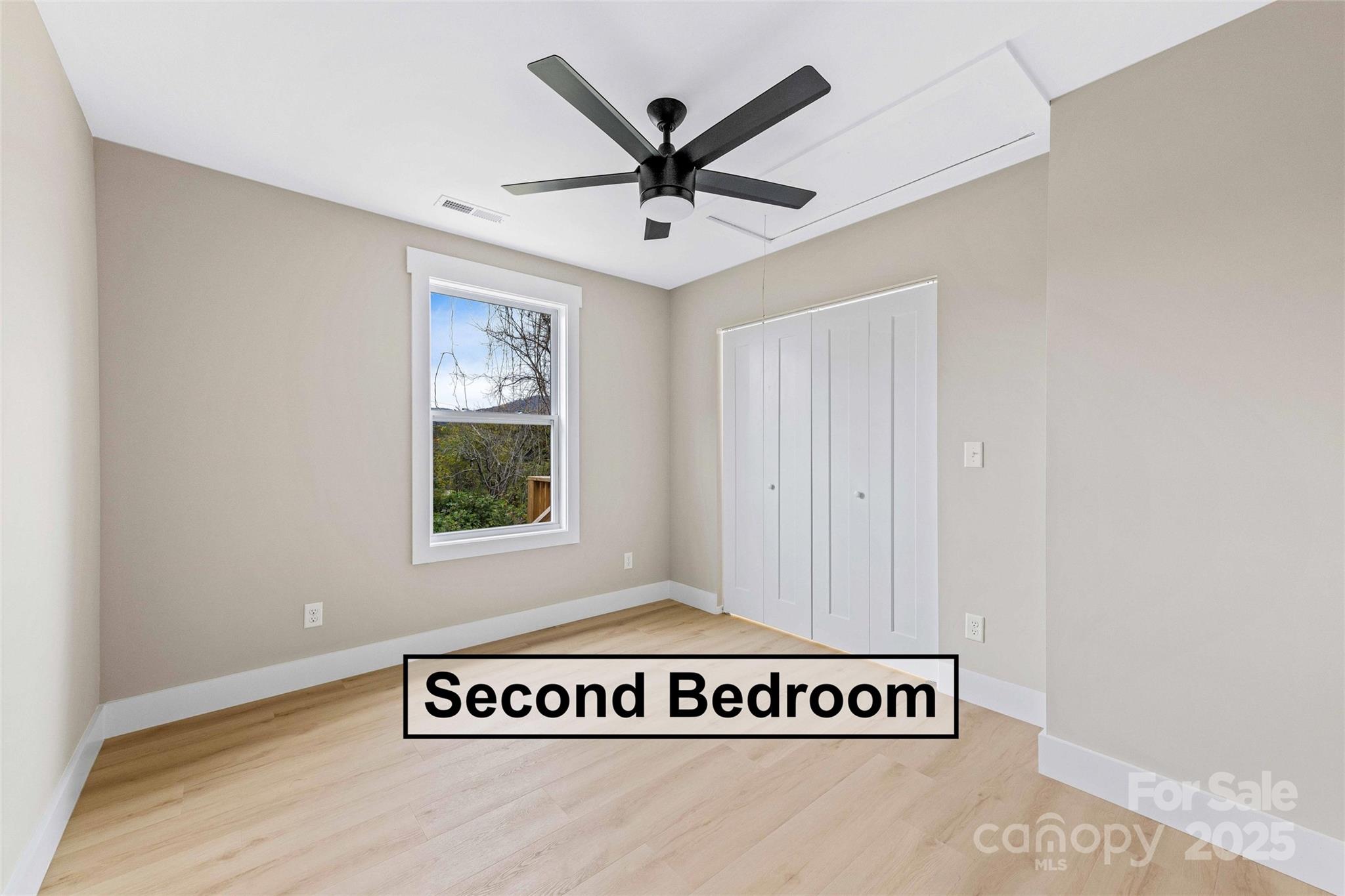 775 Olivette Road Asheville, NC 28804 - Photo 33 of 45 a view of a ceiling fan in a room