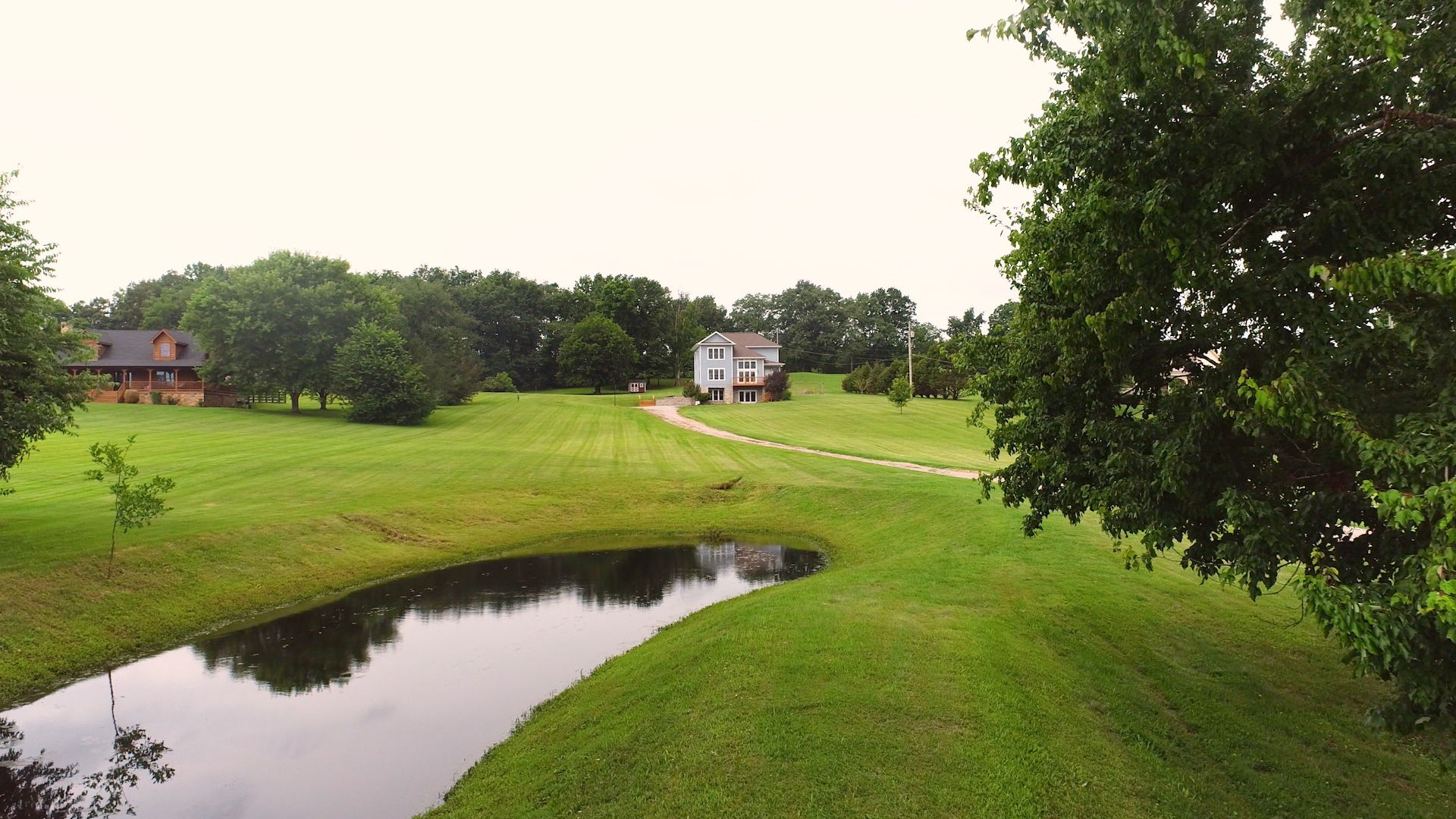 447 Ranch Road Portland, TN 37148 - Photo 1 of 27 a view of a golf course with a lake