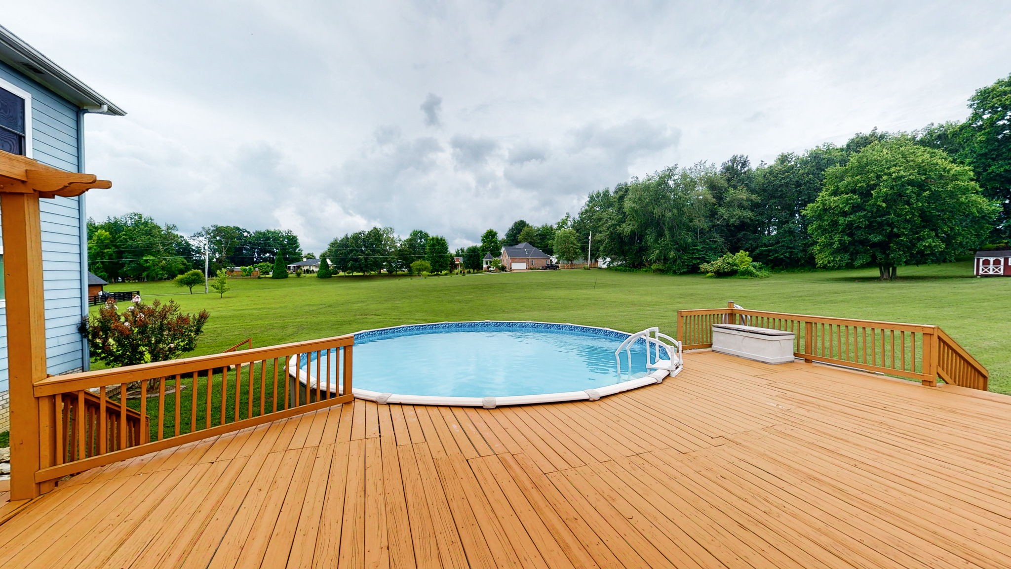 447 Ranch Road Portland, TN 37148 - Photo 22 of 27 a view of a swimming pool with a garden and trees