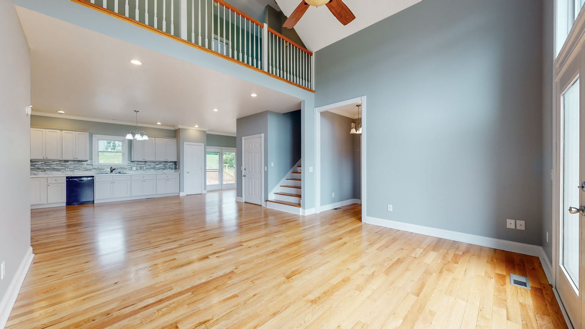 447 Ranch Road Portland, TN 37148 - Photo 5 of 27 a view of a livingroom with wooden floor and a kitchen