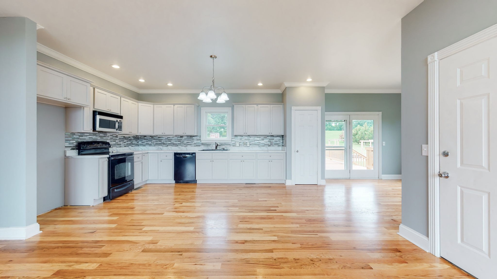 447 Ranch Road Portland, TN 37148 - Photo 7 of 27 a large kitchen with kitchen island a sink stainless steel appliances and cabinets