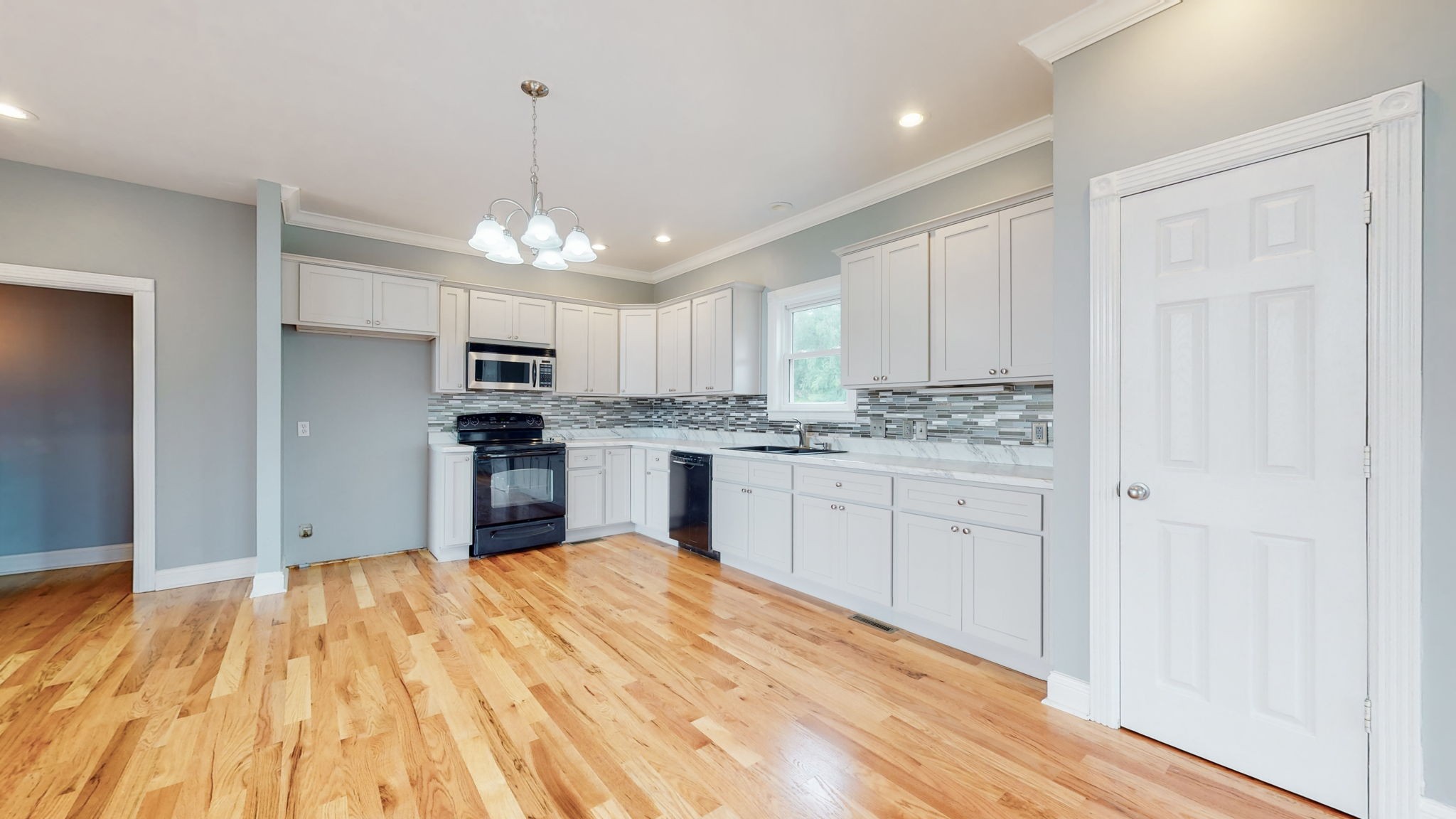 447 Ranch Road Portland, TN 37148 - Photo 8 of 27 a kitchen with kitchen island a sink stainless steel appliances and cabinets