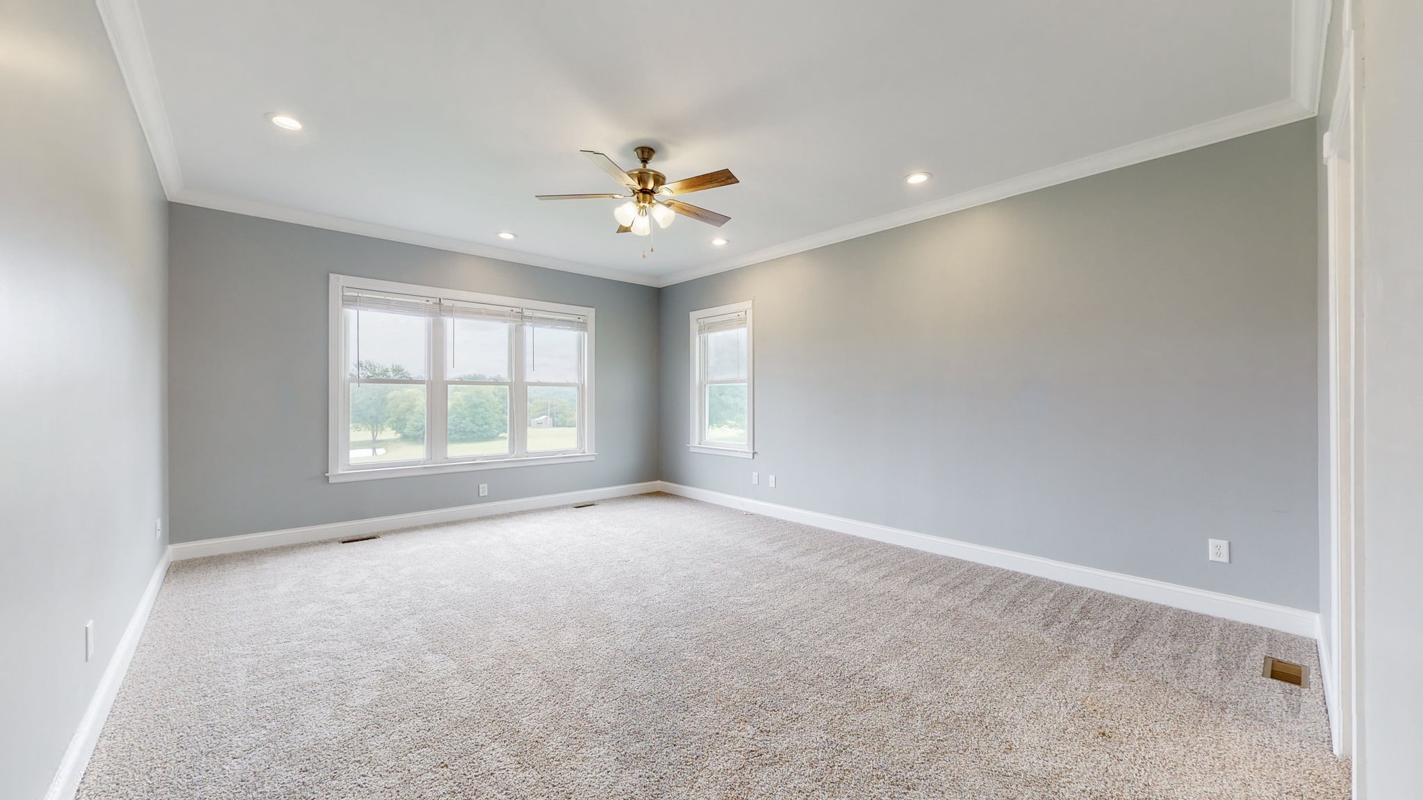 447 Ranch Road Portland, TN 37148 - Photo 10 of 27 an empty room with windows and ceiling fan