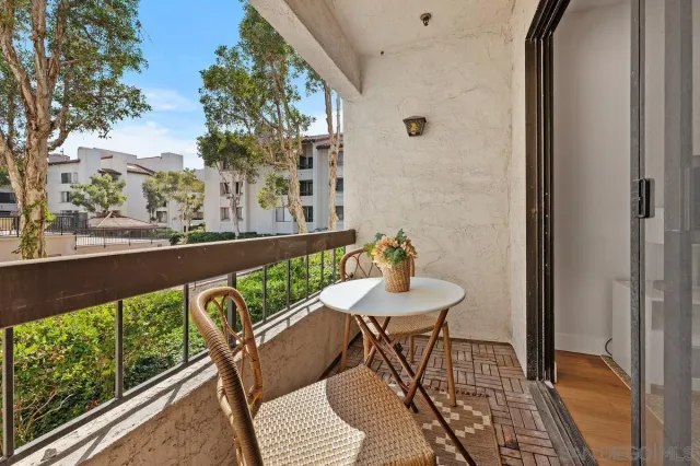 a view of a swimming pool with chairs