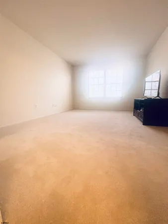 a view of empty room with a window