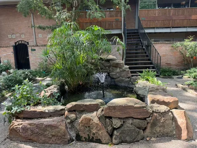 a view of a backyard with sitting area