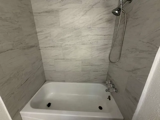 a bathroom with a bath tub