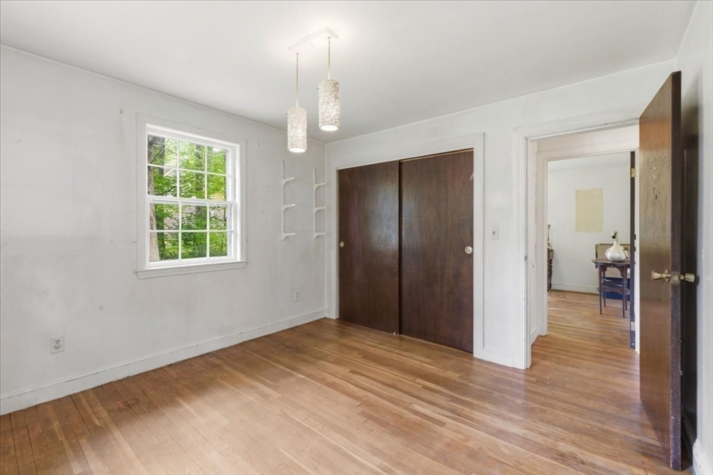 99 Brook Road Sharon, MA 02067 - Photo 17 of 37 a view of empty room with wooden floor