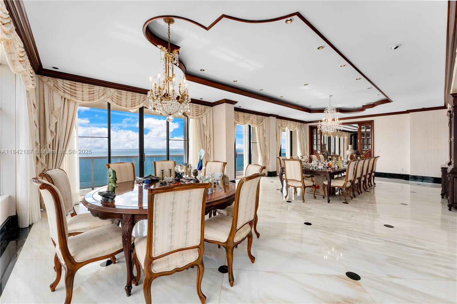 5757 Collins Avenue, Unit PH4 Miami Beach, FL 33140 - Photo 12 of 27 a view of a dining room with furniture window and outside view