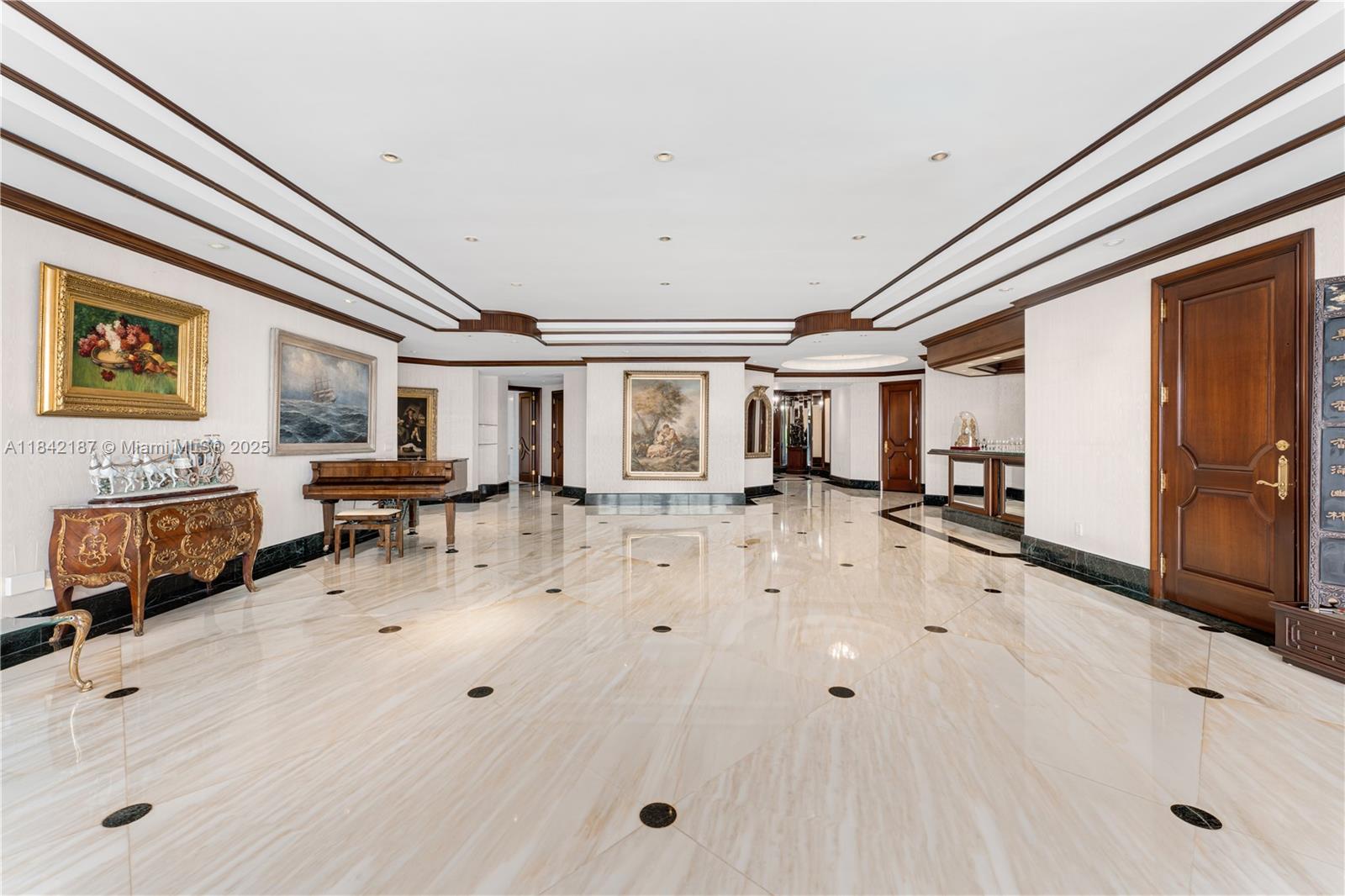 5757 Collins Avenue, Unit PH4 Miami Beach, FL 33140 - Photo 13 of 27 a living room with furniture