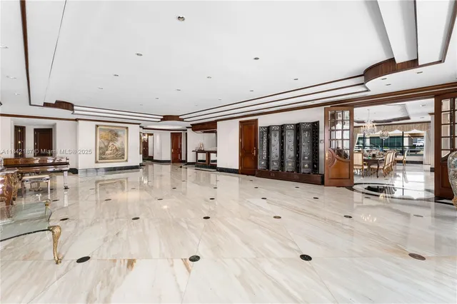 a large white kitchen with a large window