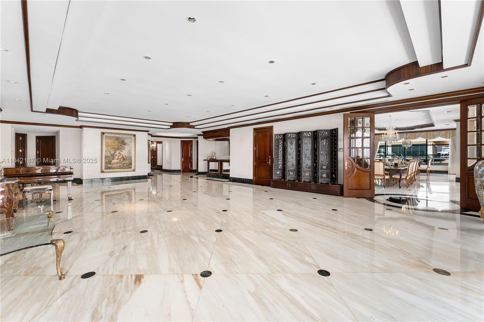 5757 Collins Avenue, Unit PH4 Miami Beach, FL 33140 - Photo 14 of 27 a view of a house with wooden floor