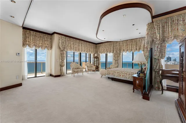 a kitchen with granite countertop a sink a stove and cabinets