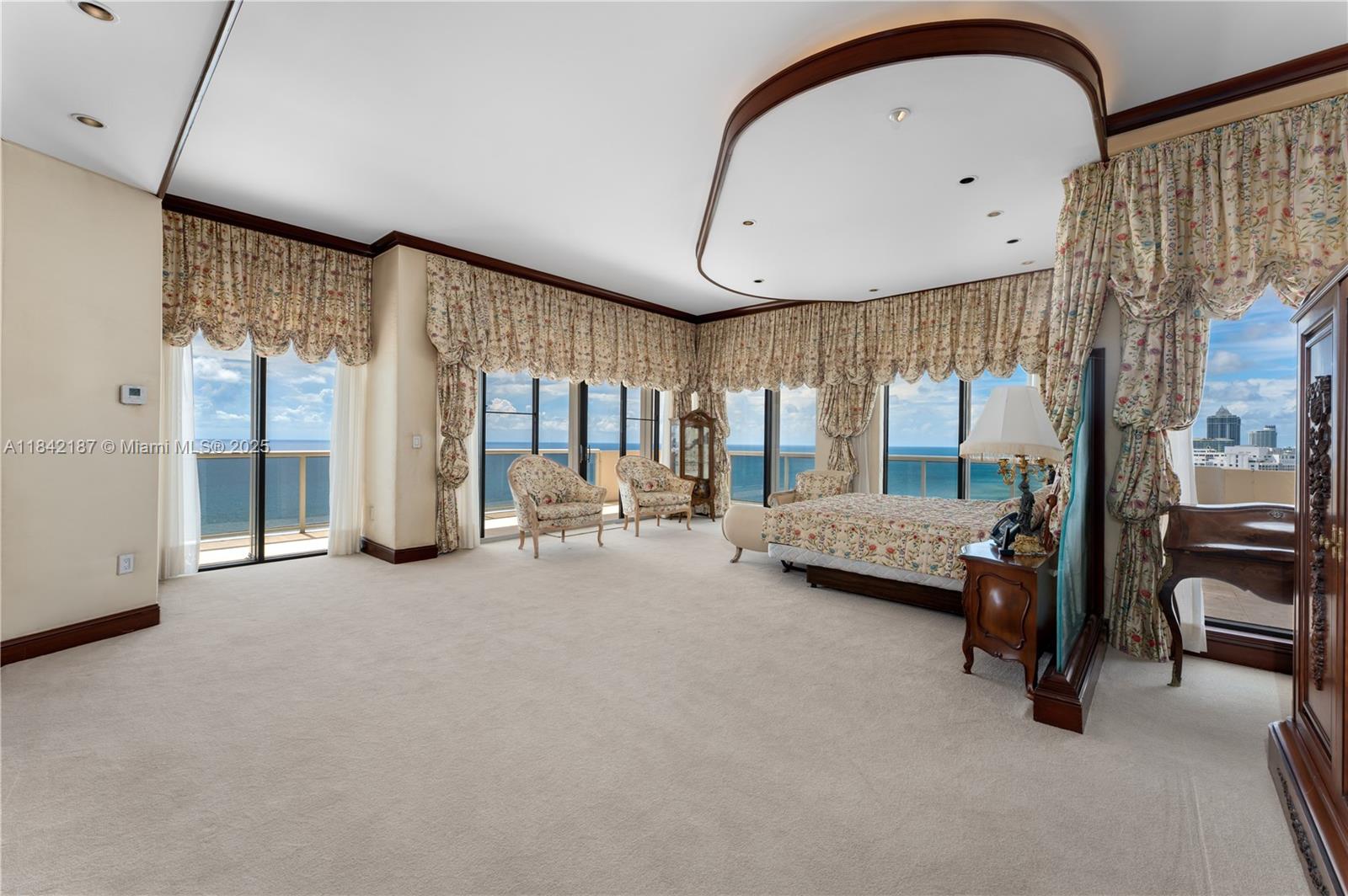 5757 Collins Avenue, Unit PH4 Miami Beach, FL 33140 - Photo 18 of 27 a view of livingroom with furniture and a window