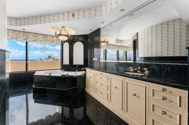 a kitchen with stainless steel appliances granite countertop a sink and cabinets