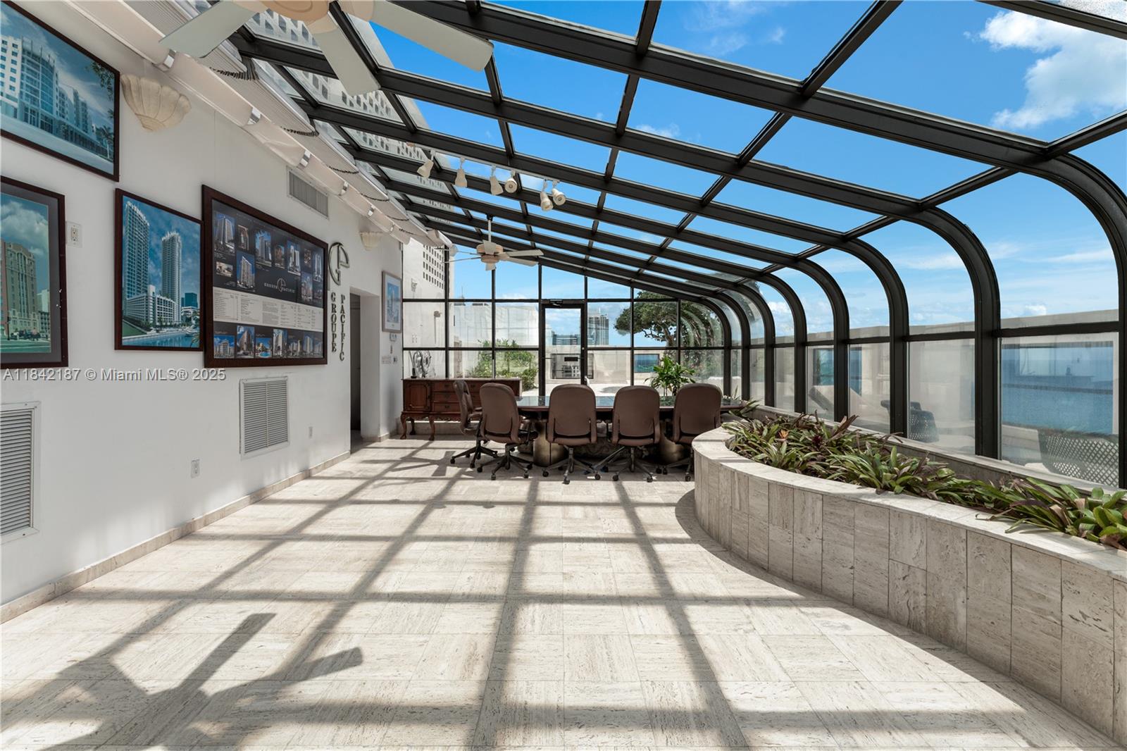 5757 Collins Avenue, Unit PH4 Miami Beach, FL 33140 - Photo 21 of 27 a view of living room and kitchen with furniture