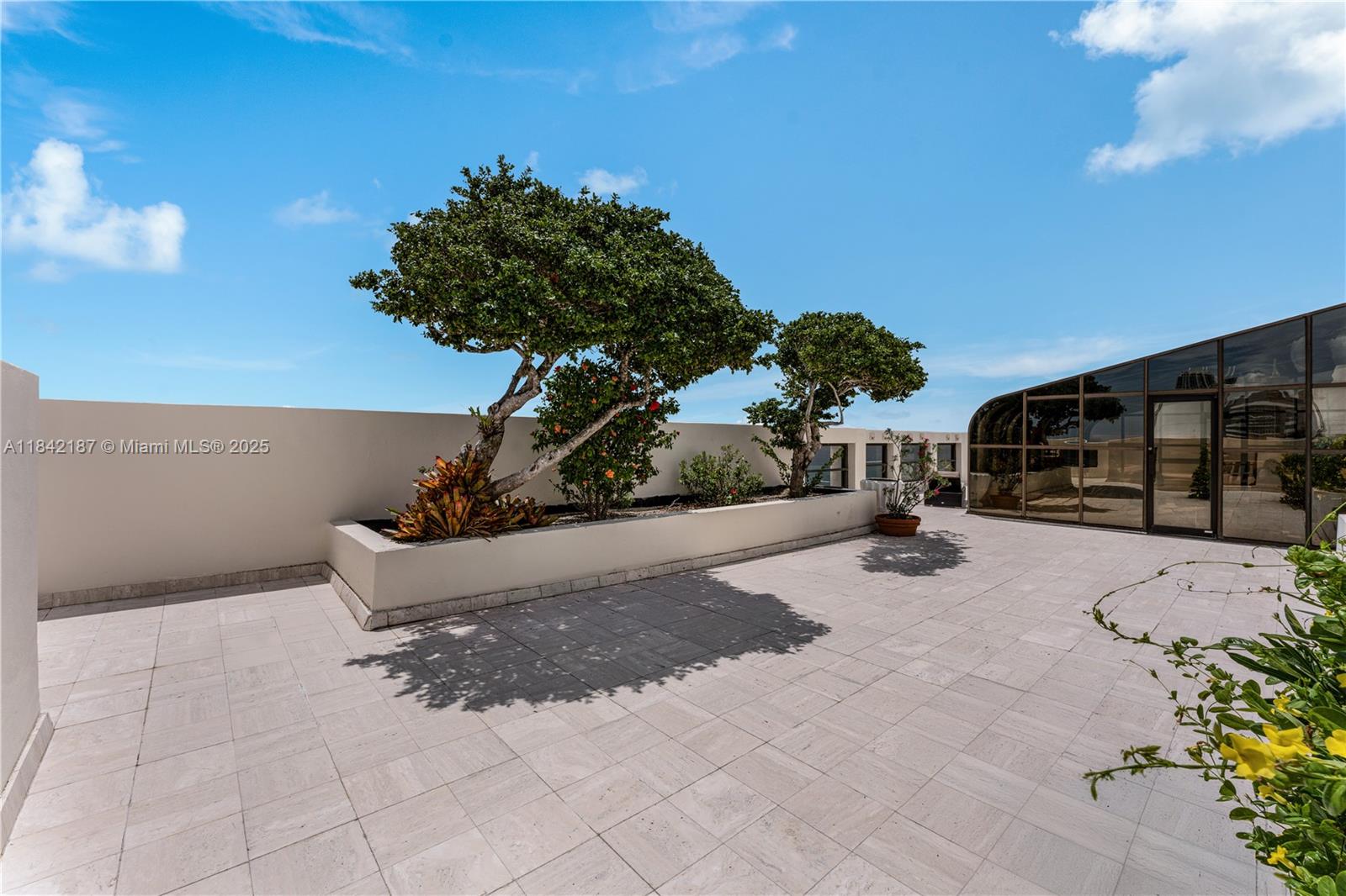 5757 Collins Avenue, Unit PH4 Miami Beach, FL 33140 - Photo 22 of 27 a view of outdoor space and yard