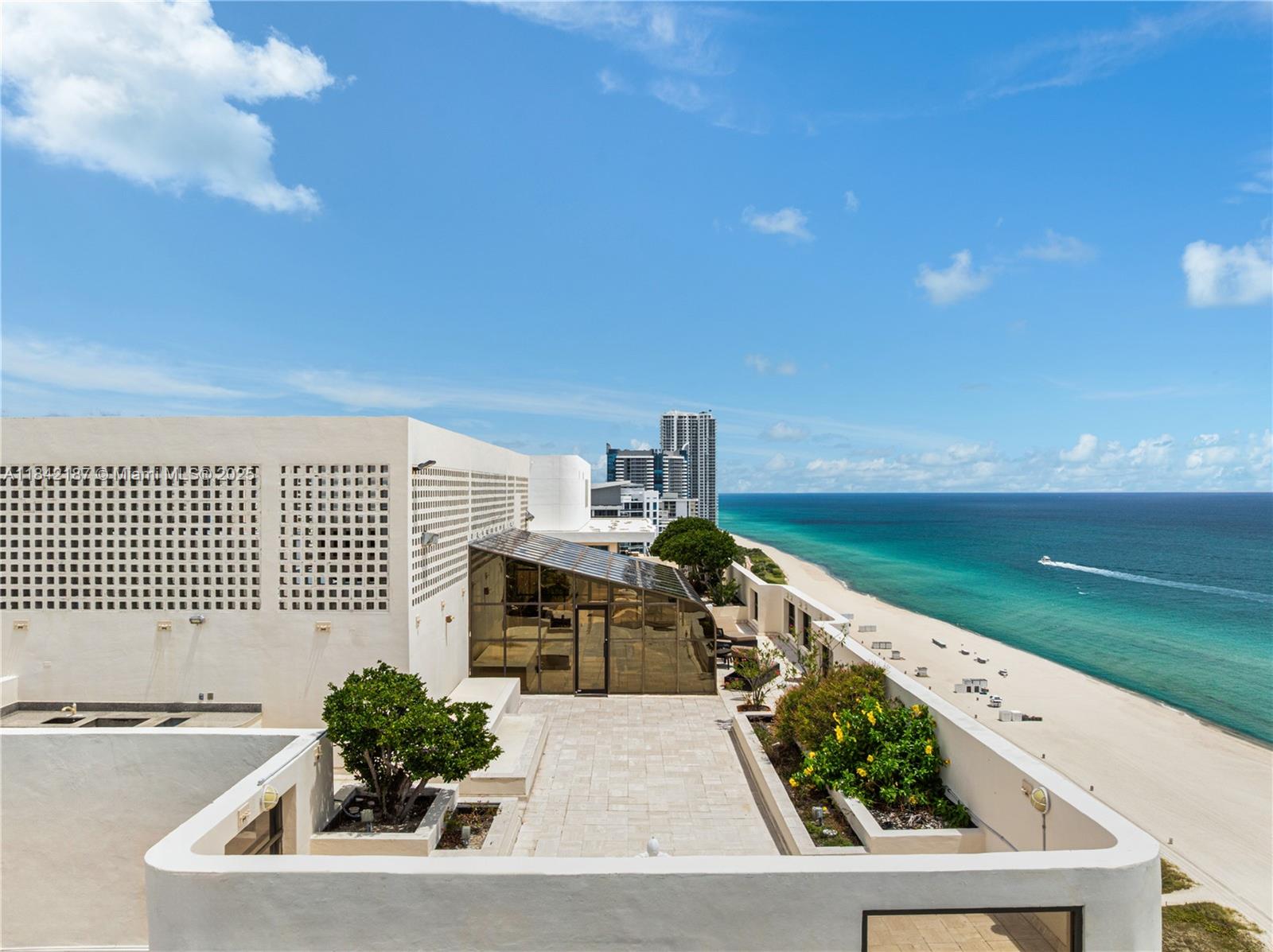 5757 Collins Avenue, Unit PH4 Miami Beach, FL 33140 - Photo 23 of 27 a view of a swimming pool and outdoor space