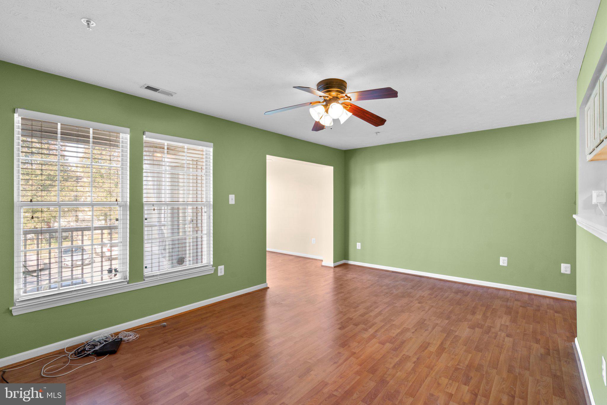 7641 Gladstone Road, Unit 57641 Windsor Mill, MD 21244 - Photo 6 of 26 Living room with hardwood
