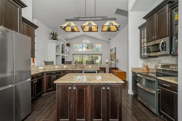 a kitchen with a stove and a microwave