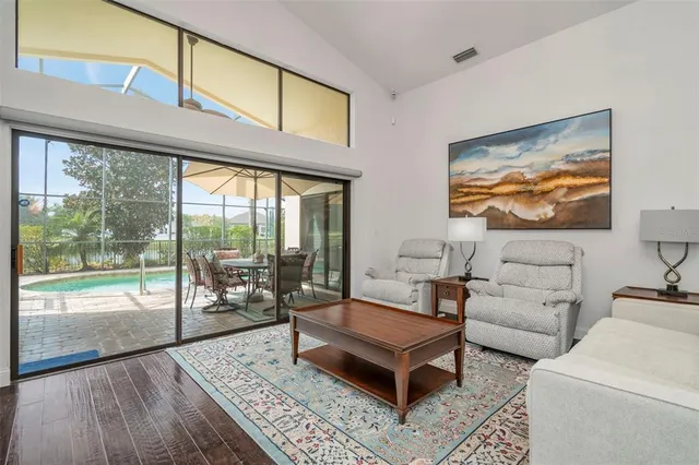 a living room with fireplace furniture and a flat screen tv