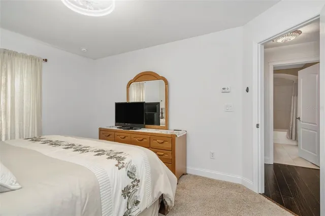 a bathroom with a granite countertop sink and a bathtub