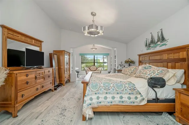 a living room with furniture and a floor to ceiling window