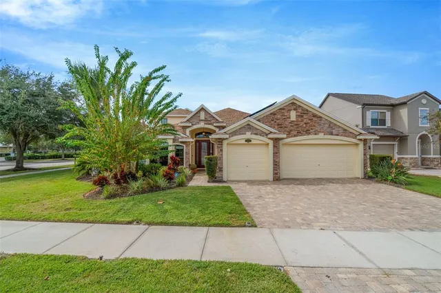 a view of a room with wooden floor and windows