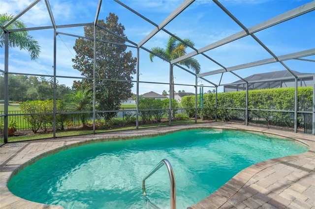 a view of a swimming pool with a patio
