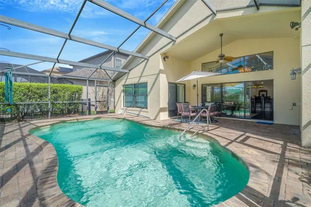 a view of a swimming pool with a porch