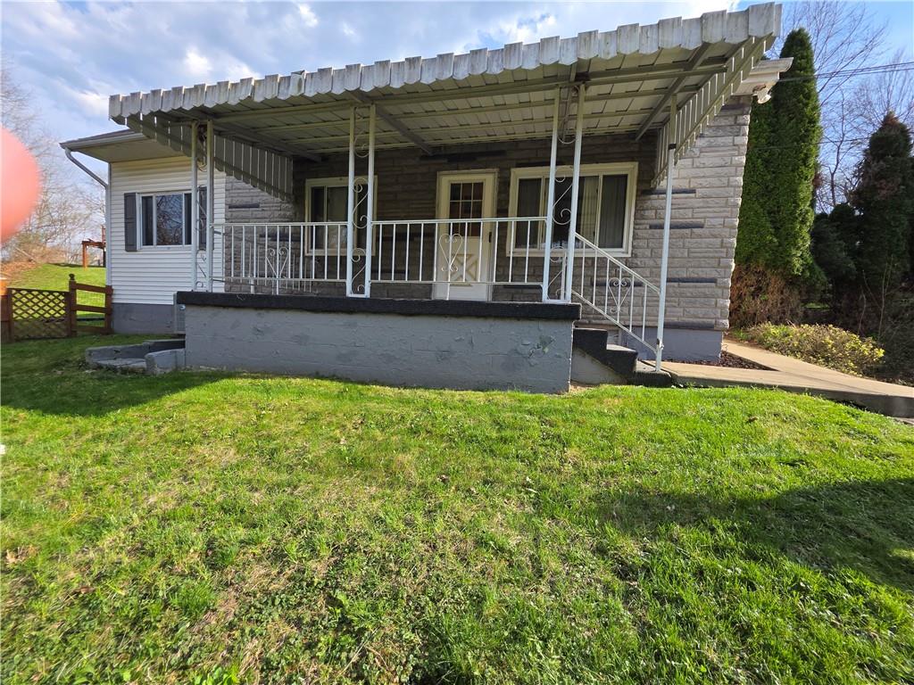 front view of a house with a yard