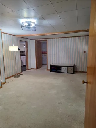 an empty room with a view of a bathroom